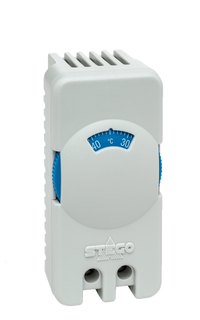 White thermostat with temperature display on a white background