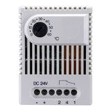 White electronic device with dial and ports on a white background