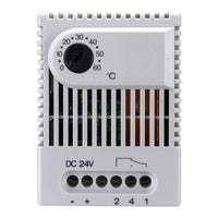 White electronic device with dial and ports on a white background