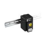 Black industrial sensor with a yellow warning label on a white background