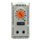 Thermostat with orange dial and white casing on a white background