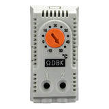Thermostat with orange dial and white casing on a white background