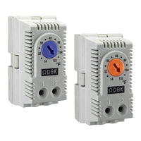 Two wall-mounted DIN rail enclosure thermostats with adjustable dials, one labeled for heating in Fahrenheit with a blue dial, and the other for cooling in Celsius with an orange dial.