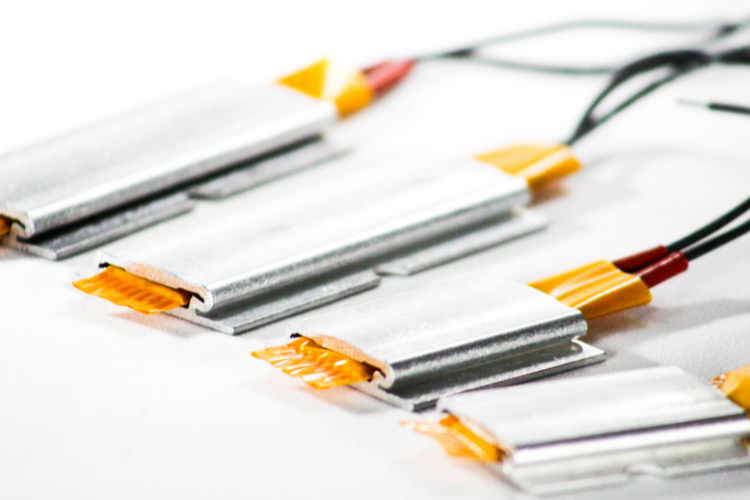 Close-up of electronic cables with connectors on a white background.